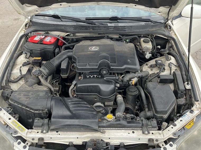 Dusty engine bay before an engine bay detail